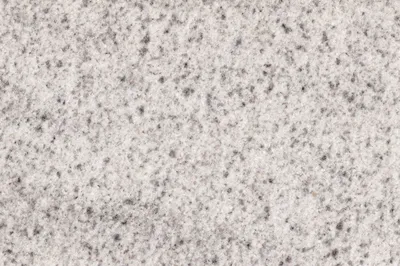Белый гранит с серыми вкраплениями мелкой фракции, полированная поверхность  натурального камня. - Ozero - российский фотосток