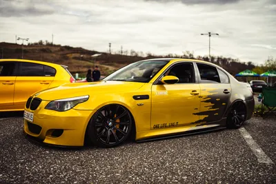 BMW E60 Parked on Grey Concrete Road · Free Stock Photo