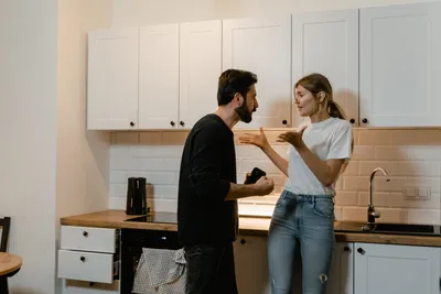 Family quarrel, wife scolds her husband, young, beautiful wife beats her  husband with a stick. The concept of the psychology of family relations,  marriage, domestic conflicts, domestic violence. Stock Photo by  ©MarkoAliaksandr