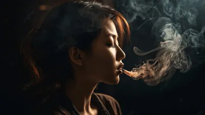 Красивая девушка курит у окна сигарету фотография Stock | Adobe Stock