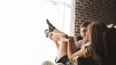 Boyfriend Lying On Knees Of Attractive Girlfriend Free Stock Photo and  Image 310994450