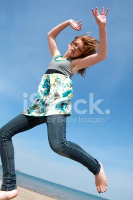 Девочка в прыжке над водой Stock Photo | Adobe Stock