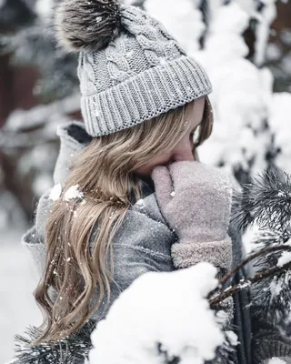 Girl walk backs winter, white village snow cold outside countryside  blizzard snowfall, yellow hat travel Stock Photo by ©shevdinov 320443408