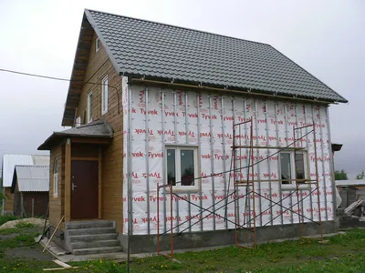 Комбинирование сайдинга и фасадных панелей в отделке домов