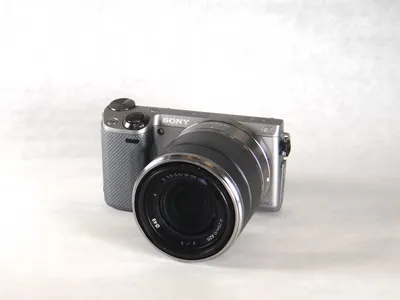 Sony Alpha NEX system - NEX-5 with zoom lens, and attachable flash folded  down in off position Stock Photo - Alamy