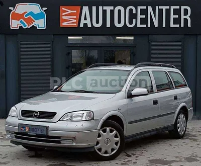 Car, Opel Astra Convertible, diesel engine, model year 2000-, orange , open  top, driving, diagonal from the back, Rear view Stock Photo - Alamy