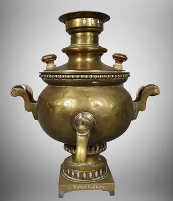 Russian samovar with a teapot on the top with bagels on it on display in  Saint Petersburg, Russia Stock Photo - Alamy