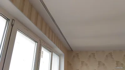 Натяжной потолок с устройством ниши под скрытый карниз для штор