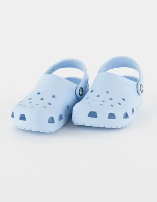 Blue crocs but they're made of a massive ford logo, and ford logos in the  background on Craiyon