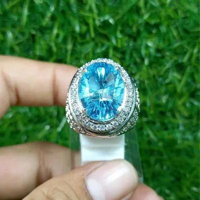 Silver earrings with oval topaz Swiss blue